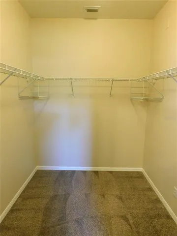 a view of a room with racks on the wall