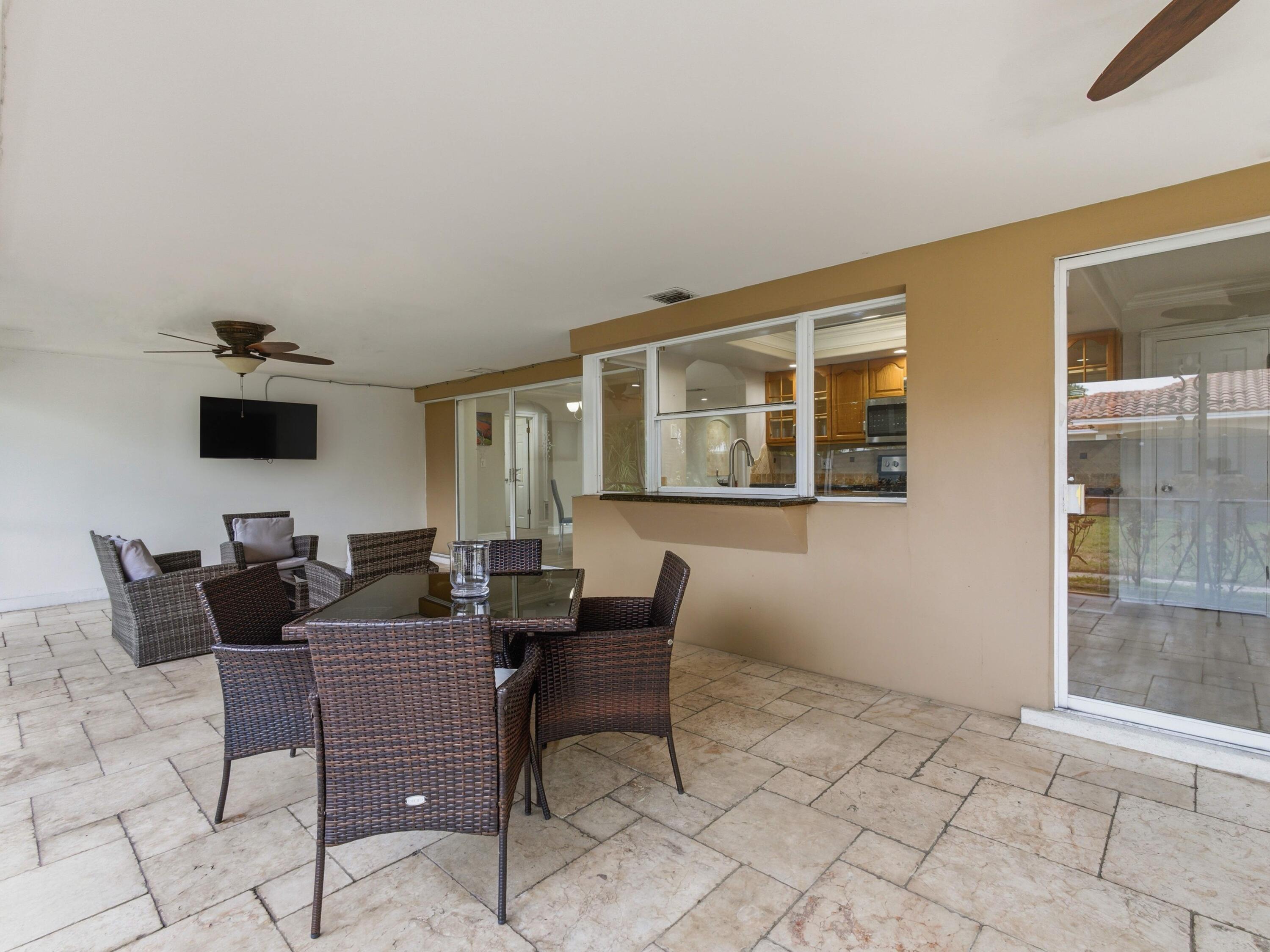 1921 Northeast 28th Court Lighthouse Point, FL 33064 - Photo 27 of 39 a view of a dining room with furniture
