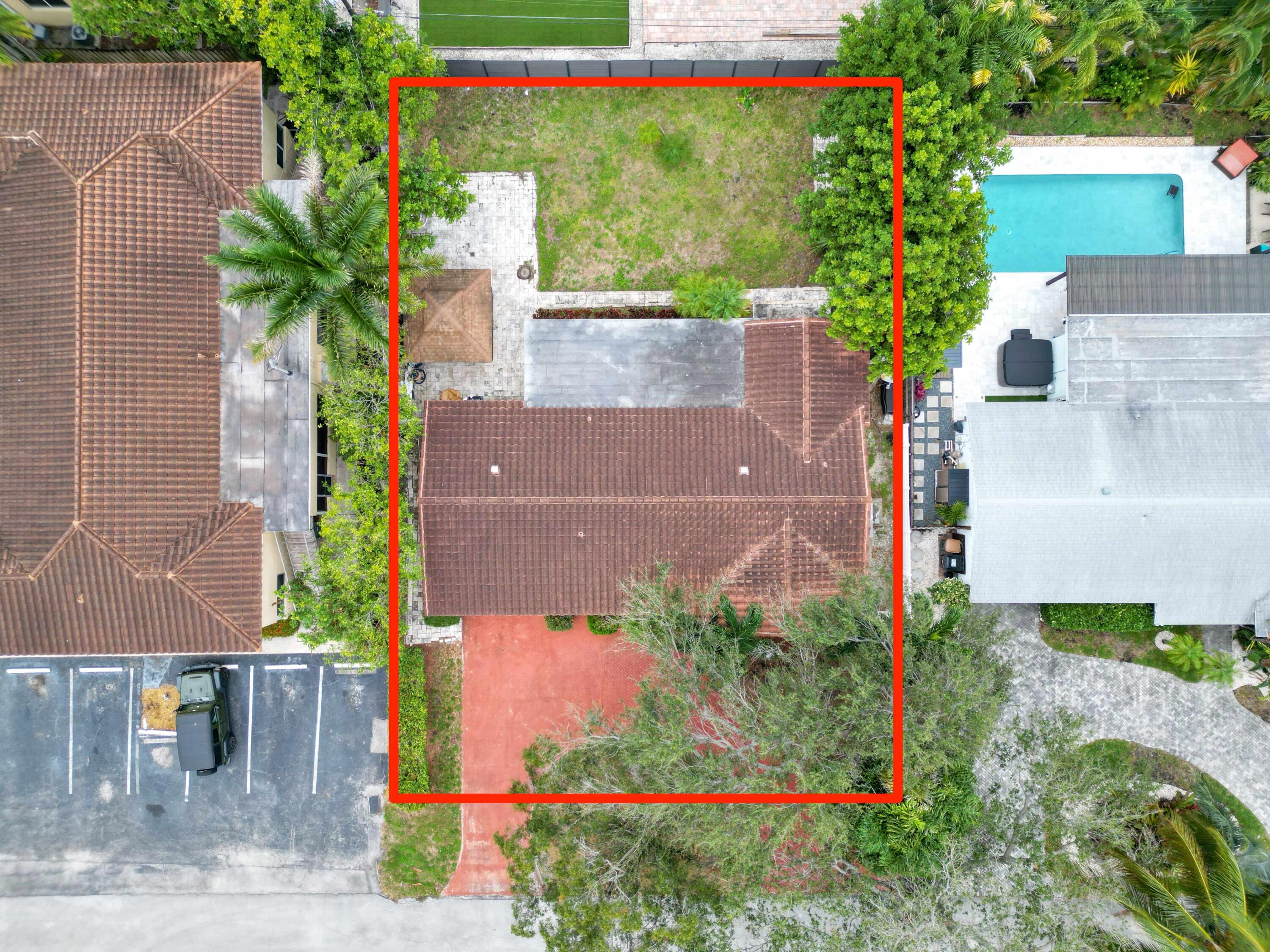 1921 Northeast 28th Court Lighthouse Point, FL 33064 - Photo 34 of 39 an aerial view of a house with a yard and a fountain