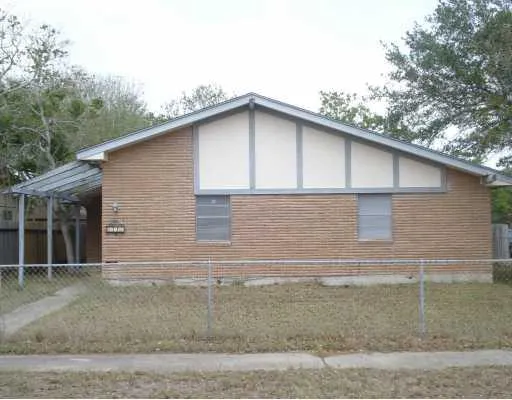 a front view of a house with garage