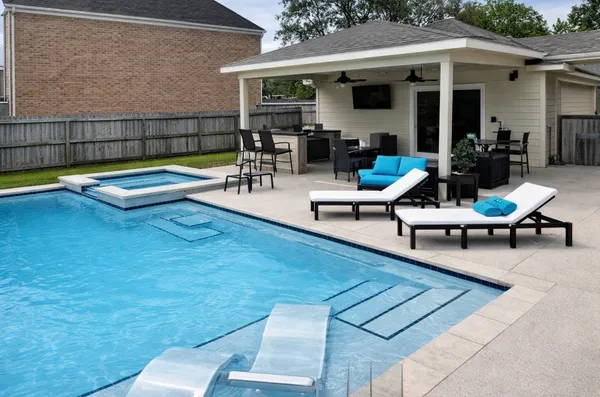a view of a backyard with a patio table and chairs