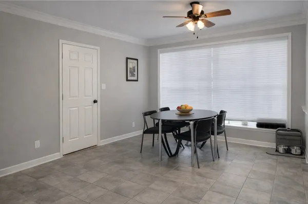 a view of living room filled with furniture and chandelier