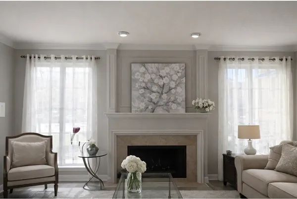 a view of a dining room with furniture and chandelier