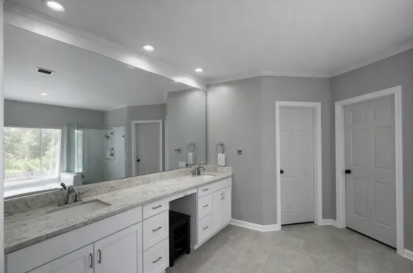 a bathroom with a large tub a shower and view