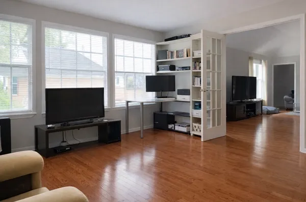 a living room with furniture and a flat screen tv