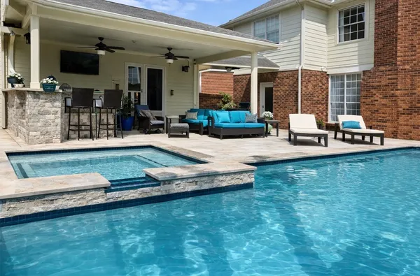 a view of a house with patio outdoor seating
