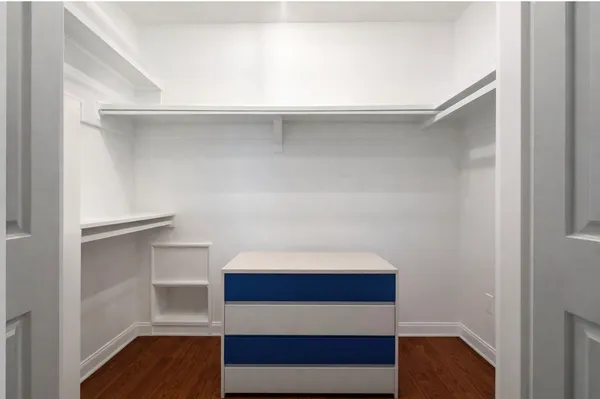 a view of a backyard with couches plants and large tree