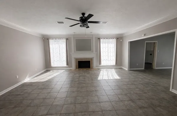 a living room with furniture and a table