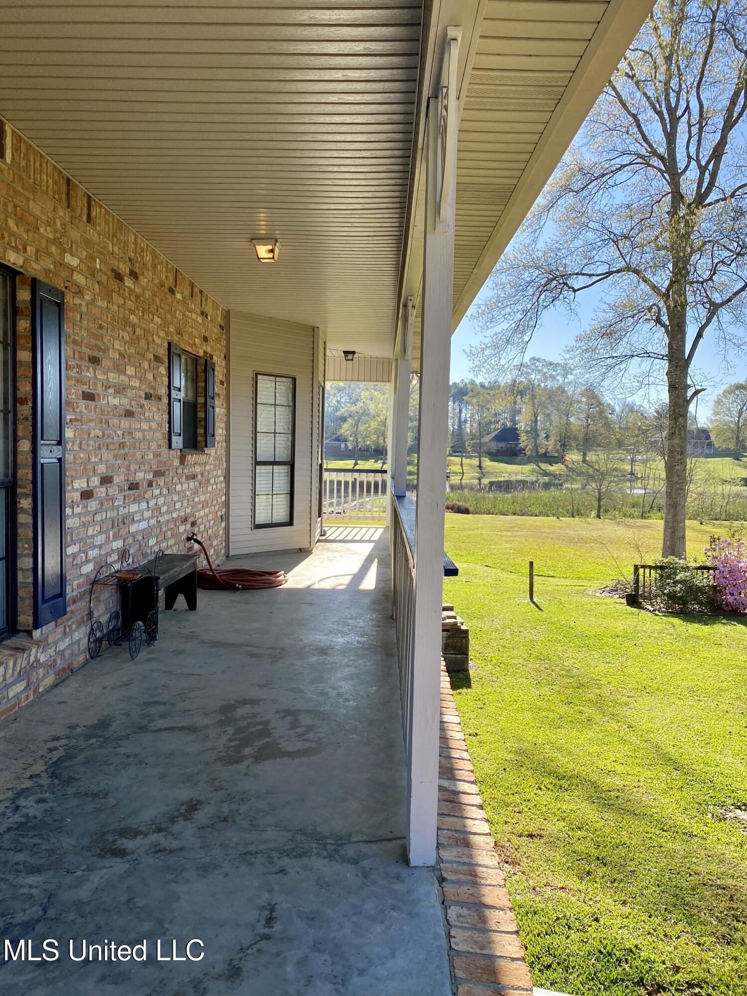 31 Cove Lake Road Carriere, MS 39426 - Photo 9 of 51 8 Side porch, IMG_2591