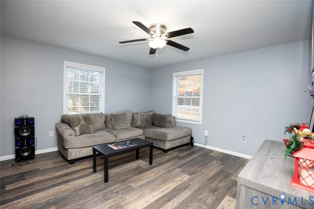 a bathroom with a granite countertop sink toilet and a mirror