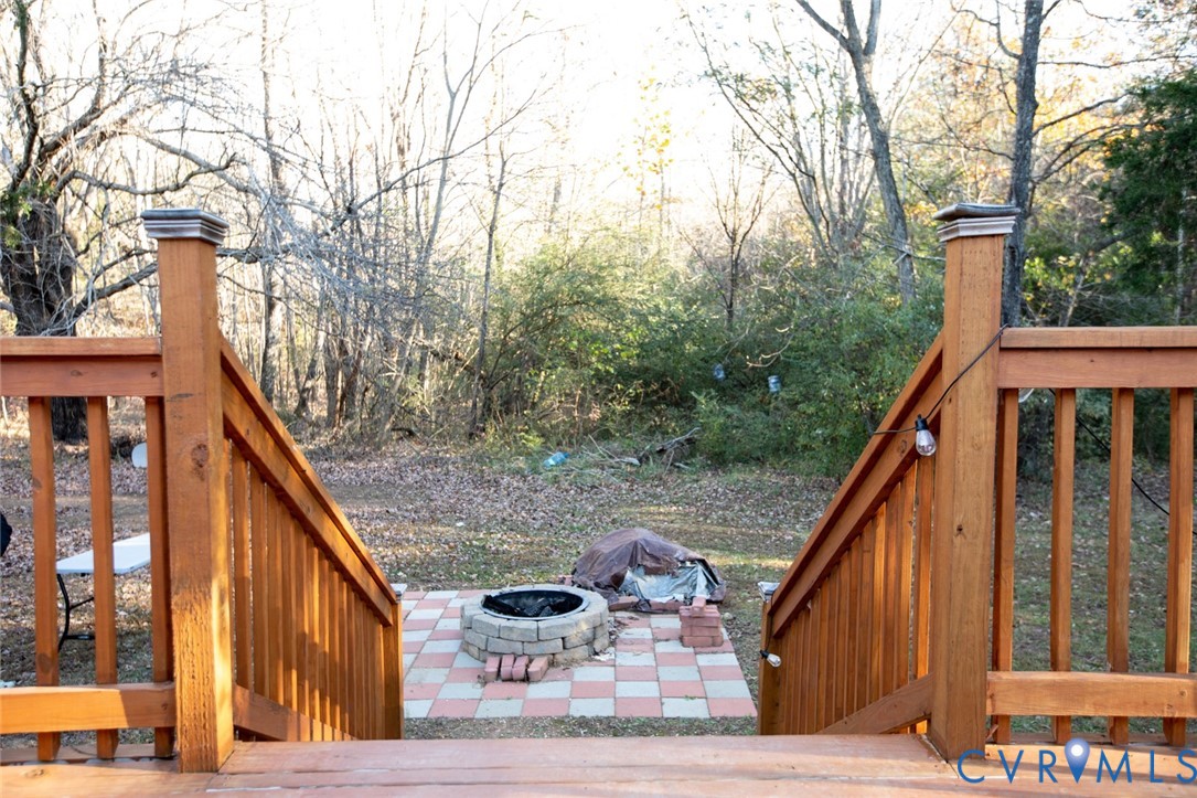 571 Five Forks Road Pamplin, VA 23958 - Photo 47 of 50 a balcony view with two plants and wooden fence