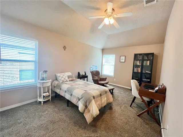 a bed room with a bed and a window