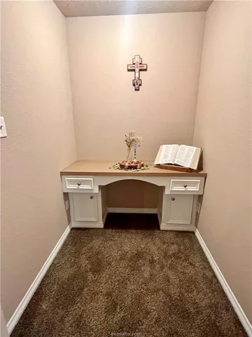 a room with a sink and a mirror