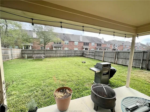 a view of a swimming pool and outdoor seating