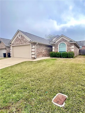 a view of a big room with a big yard and large trees