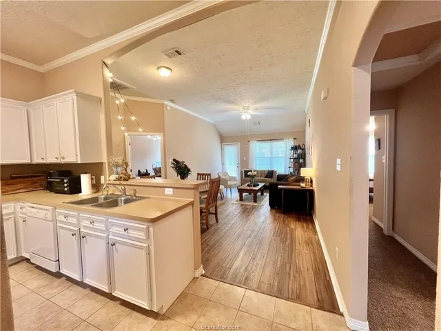 a kitchen with a sink and cabinets