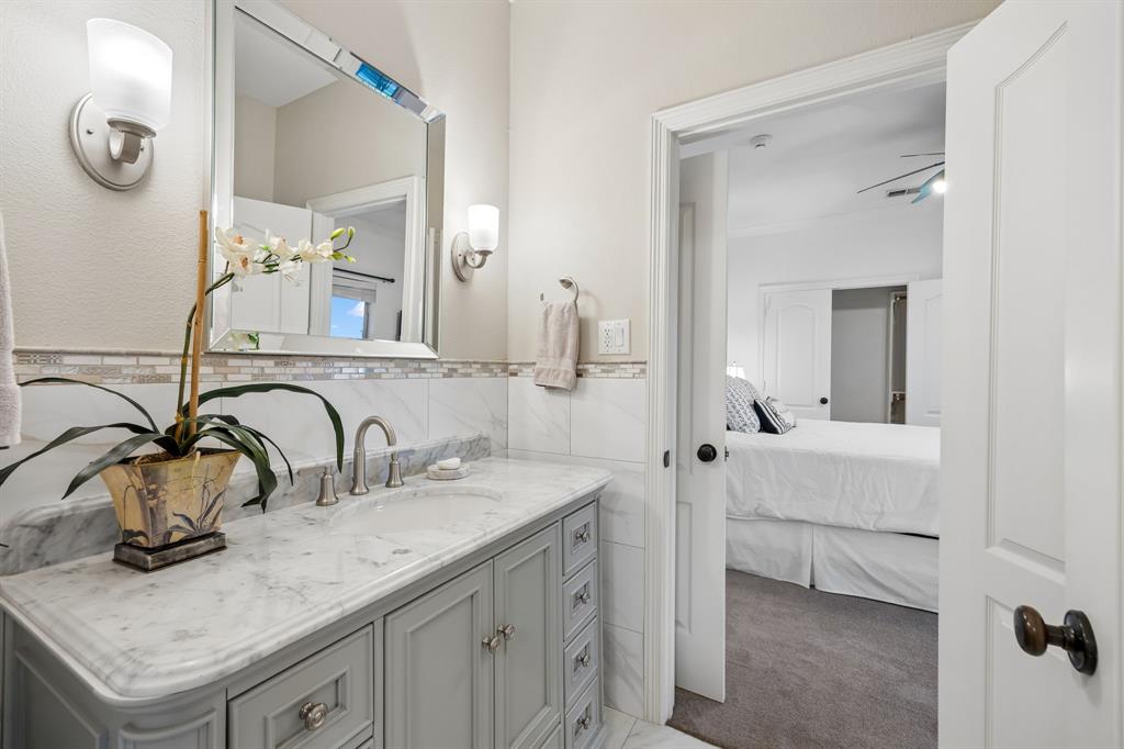 2930 Falcon Way Midlothian, TX 76065 - Photo 22 of 40 a bathroom with a sink and a mirror