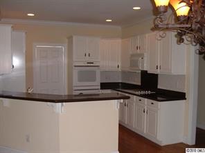 1120 Legacy Lane Fort Mill, SC 29708 - Photo 5 of 15 a kitchen with granite countertop a sink and a stove