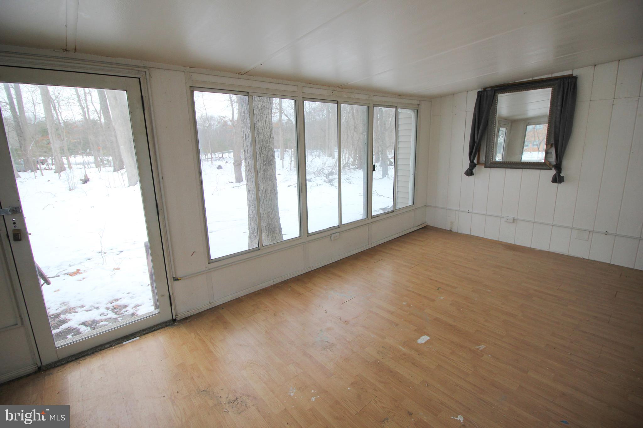 514 Hartford Road Mount Laurel, NJ 08054 - Photo 12 of 22 a view of an empty room with wooden floor and a window