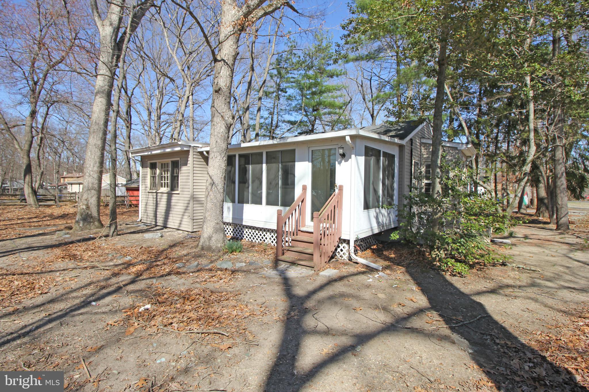 514 Hartford Road Mount Laurel, NJ 08054 - Photo 3 of 22 a house with trees in the background