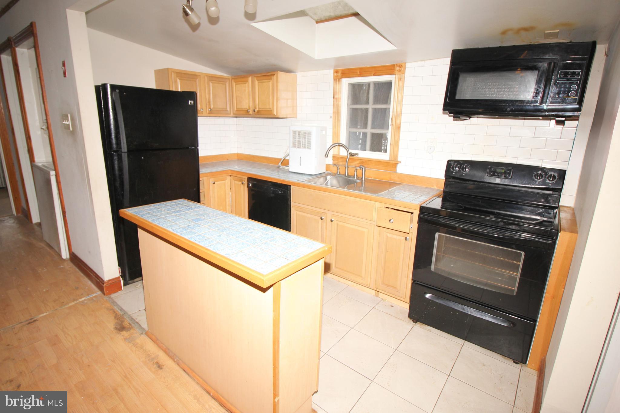 514 Hartford Road Mount Laurel, NJ 08054 - Photo 10 of 22 a kitchen with a refrigerator stove and microwave