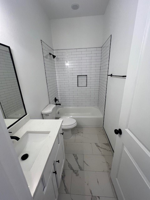 8508 Wileyvale Road, Unit B Houston, TX 77016 - Photo 13 of 16 a bathroom with a sink a toilet a mirror and shower