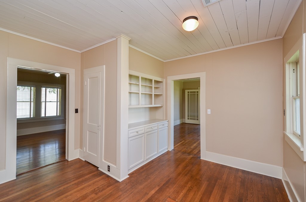 404 West Main Street Bellville, TX 77418 - Photo 13 of 25 a view of an empty room with wooden floor and a window