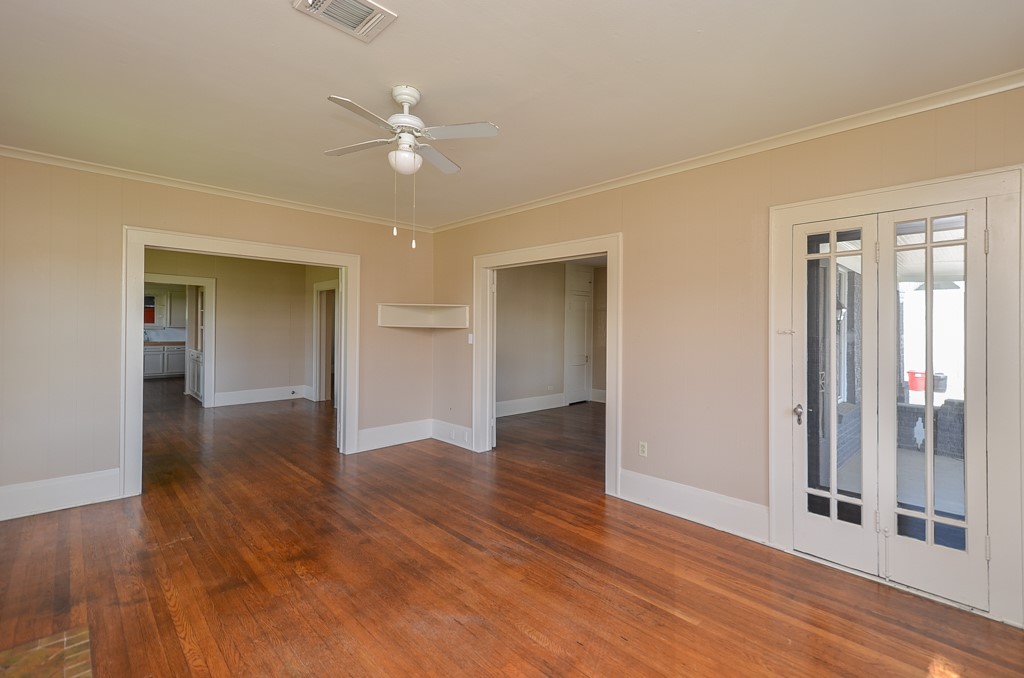 404 West Main Street Bellville, TX 77418 - Photo 14 of 25 a view of an empty room with wooden floor and a window