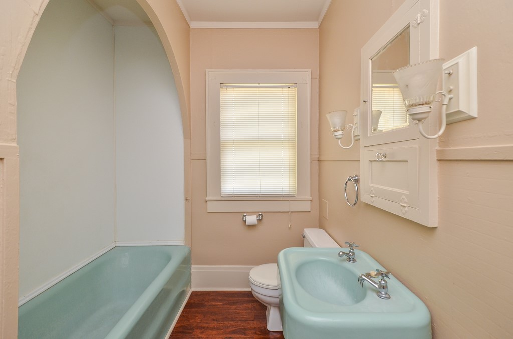 404 West Main Street Bellville, TX 77418 - Photo 16 of 25 a bathroom with a sink a toilet and tub