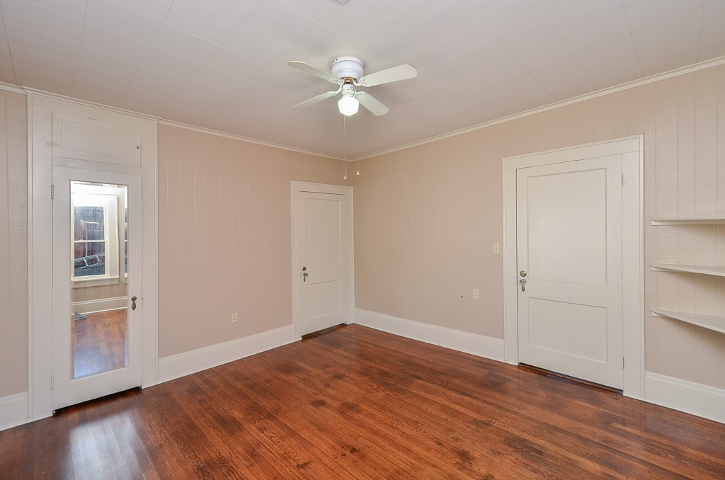 404 West Main Street Bellville, TX 77418 - Photo 17 of 25 wooden floor in an empty room with a window