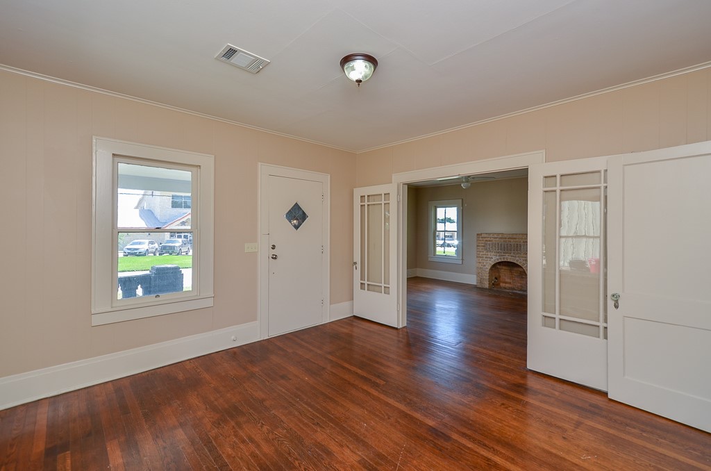 404 West Main Street Bellville, TX 77418 - Photo 19 of 25 a view of a livingroom with wooden floor and a window