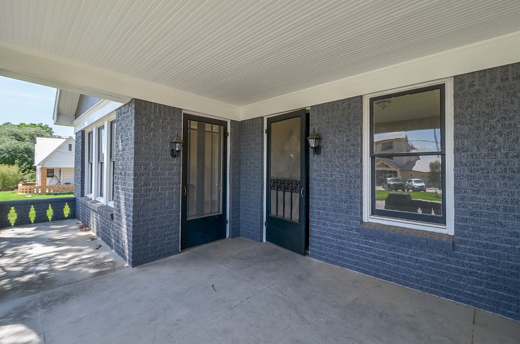 404 West Main Street Bellville, TX 77418 - Photo 3 of 25 a view of an empty room with a fireplace and a window