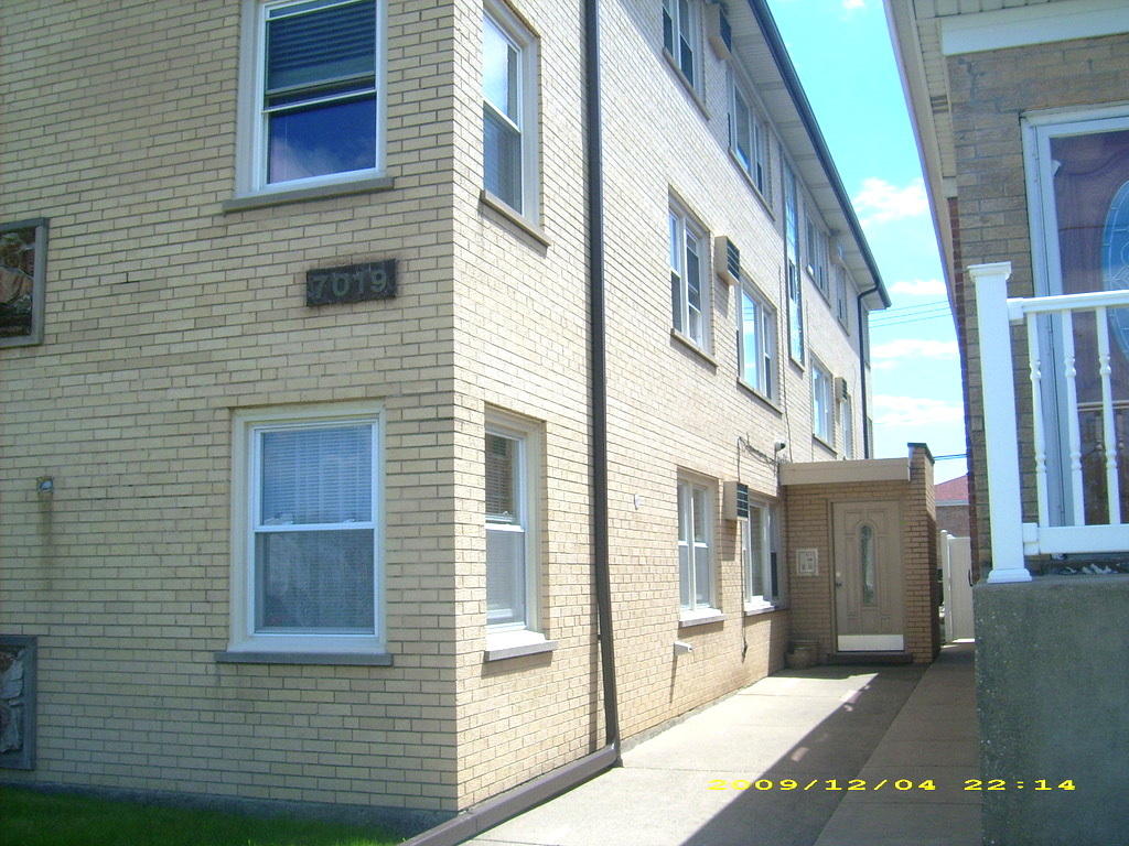 a view of a brick buildings with many windows