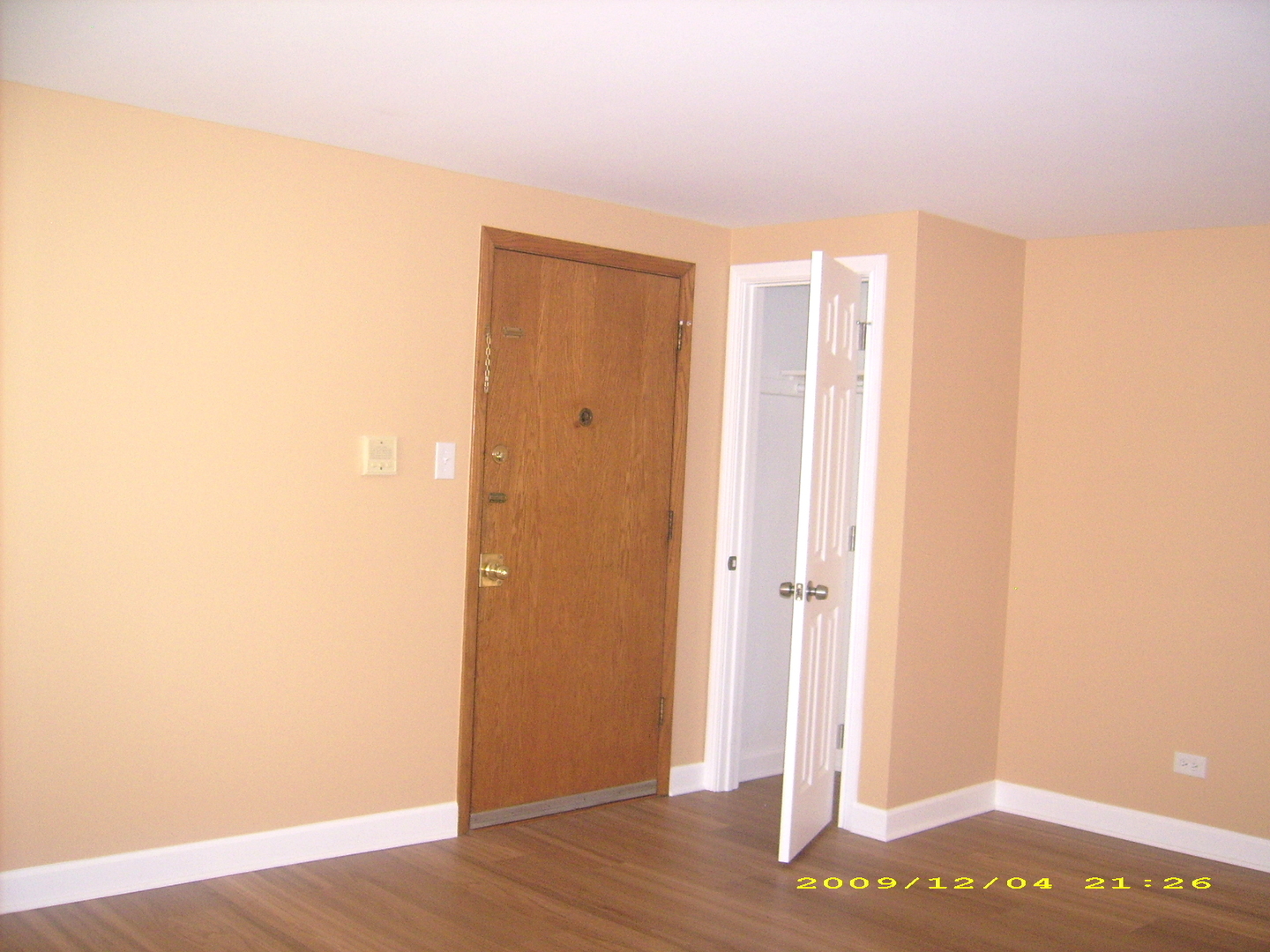 7019 West Irving Park Road, Unit 2 Chicago, IL 60634 - Photo 4 of 14 a view of an empty room with wooden floor