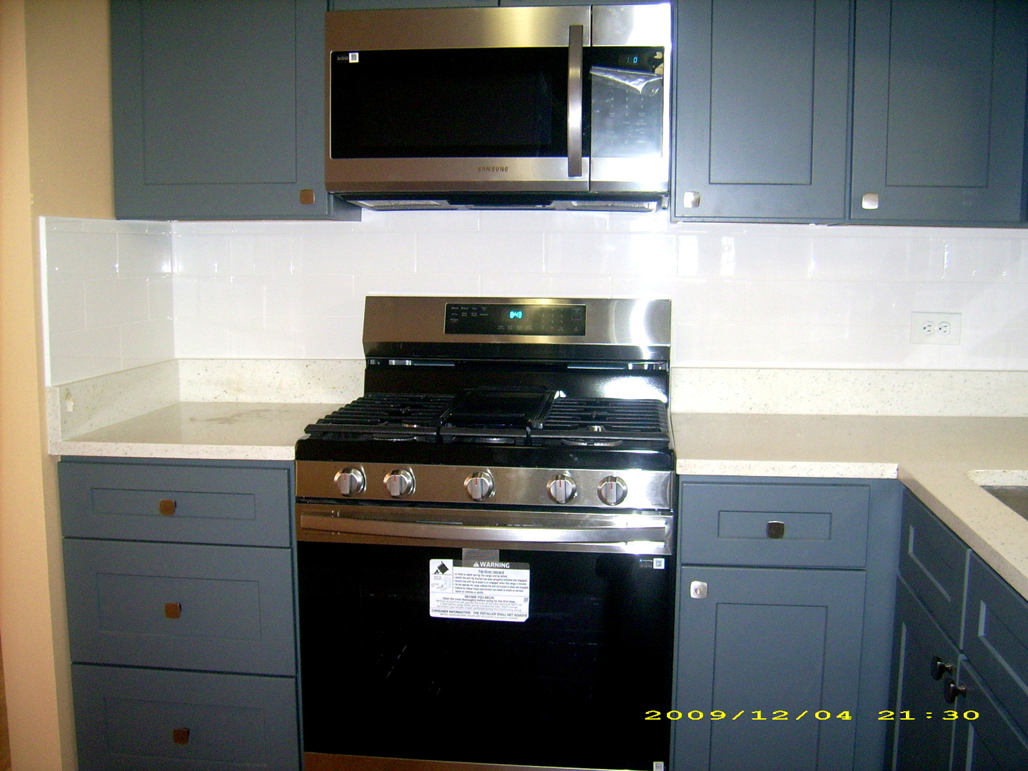 7019 West Irving Park Road, Unit 2 Chicago, IL 60634 - Photo 7 of 14 a kitchen with a stove and a microwave