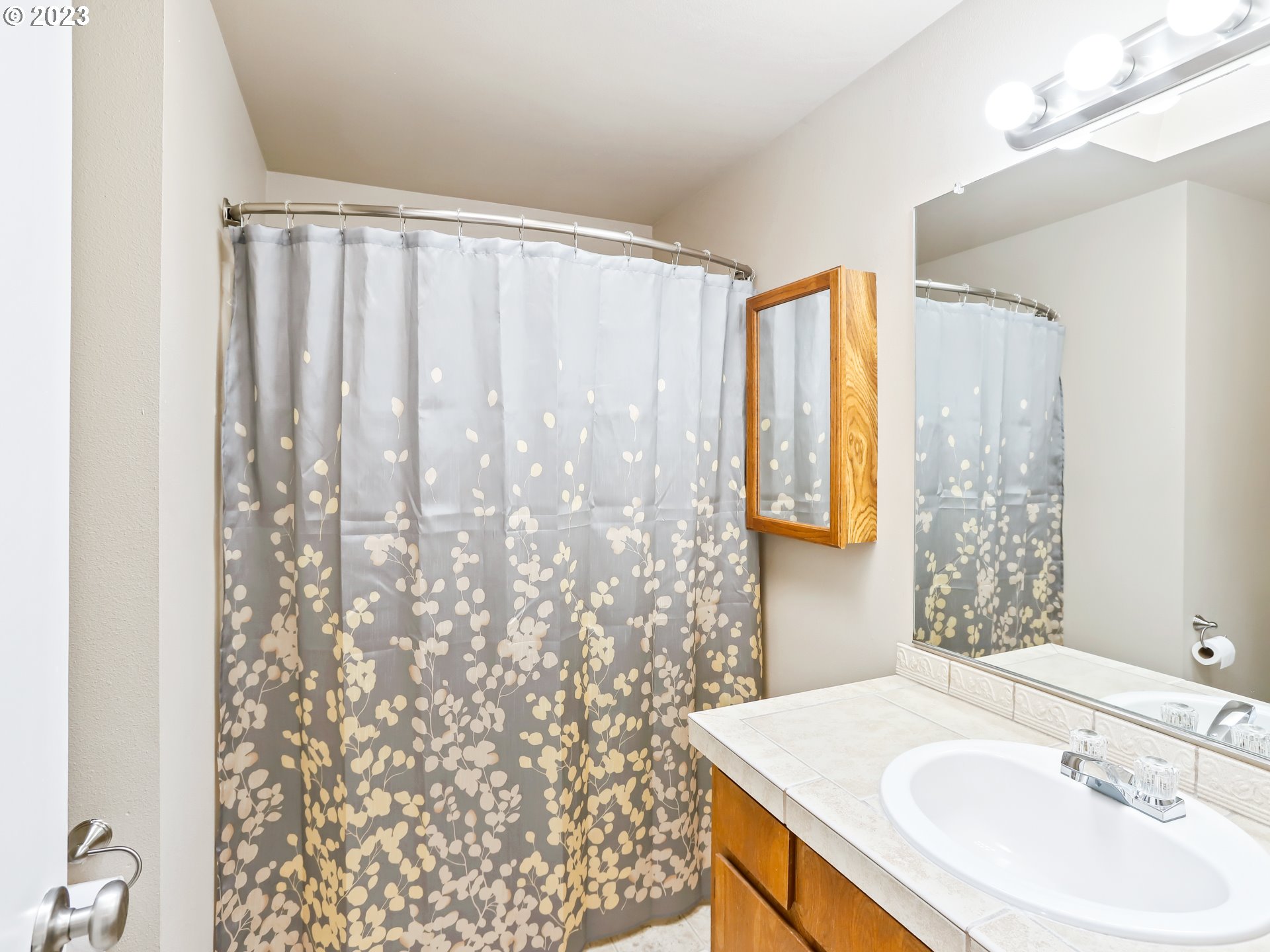 13224 Southwest Shore Drive Portland, OR 97223 - Photo 23 of 30 a bathroom with a sink and a mirror