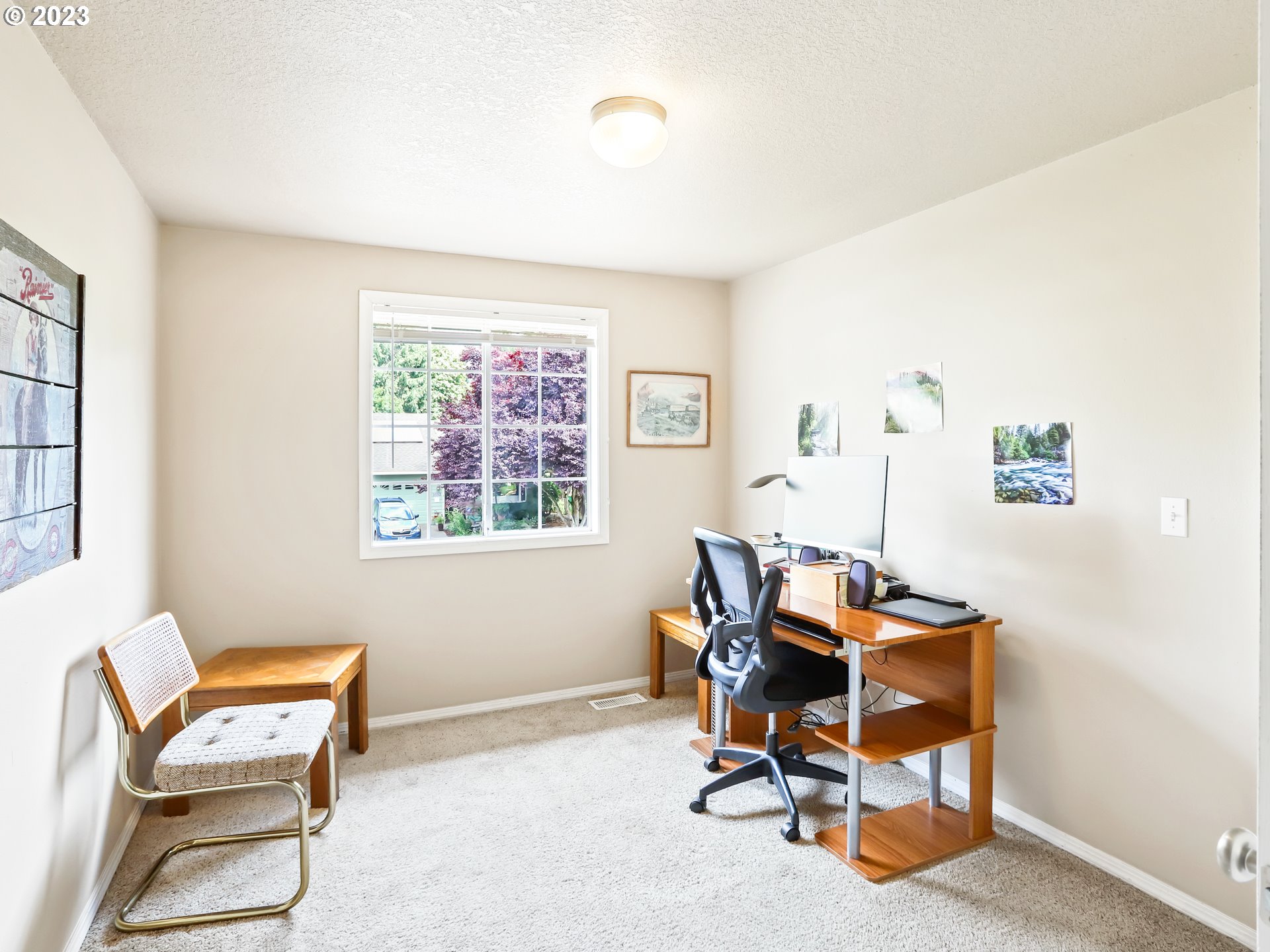 13224 Southwest Shore Drive Portland, OR 97223 - Photo 24 of 30 a view of a workspace with furniture and a window