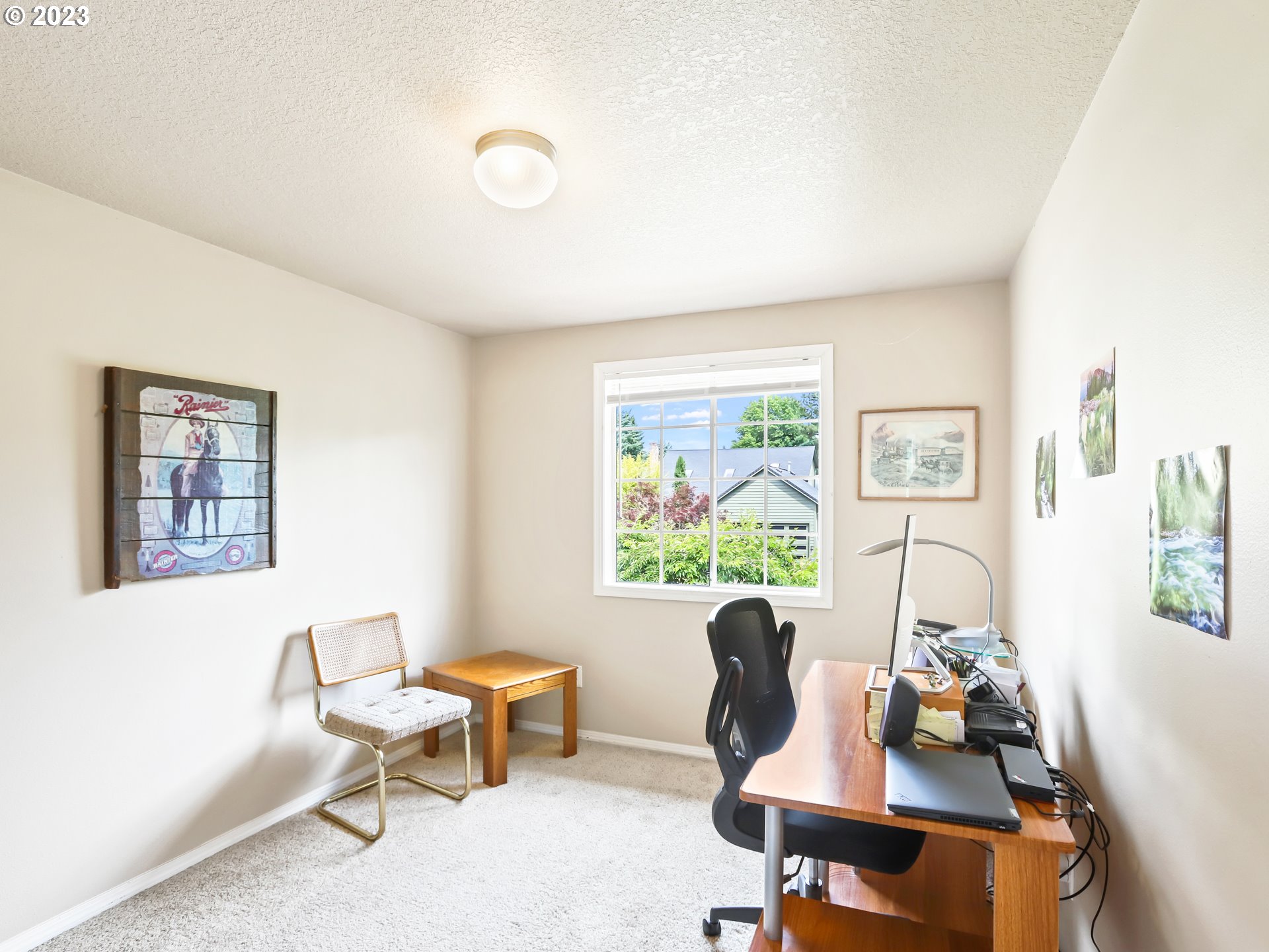 13224 Southwest Shore Drive Portland, OR 97223 - Photo 25 of 30 a living room with furniture and a window