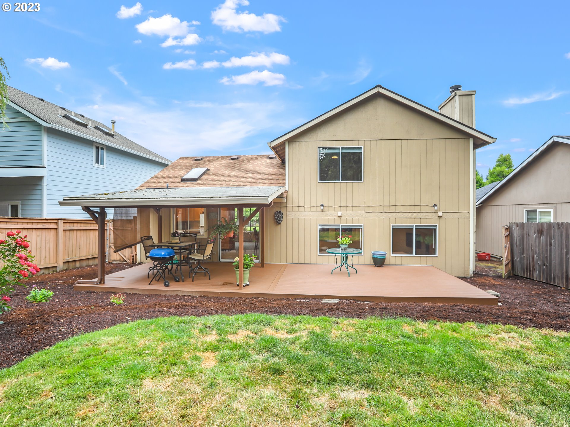 13224 Southwest Shore Drive Portland, OR 97223 - Photo 30 of 30 a view of an house with backyard space and a garden
