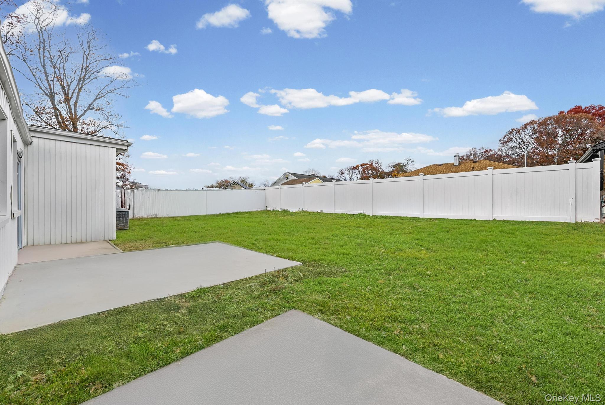 312 Coventry Road South West Hempstead, NY 11552 - Photo 4 of 30 Fenced backyard featuring a patio