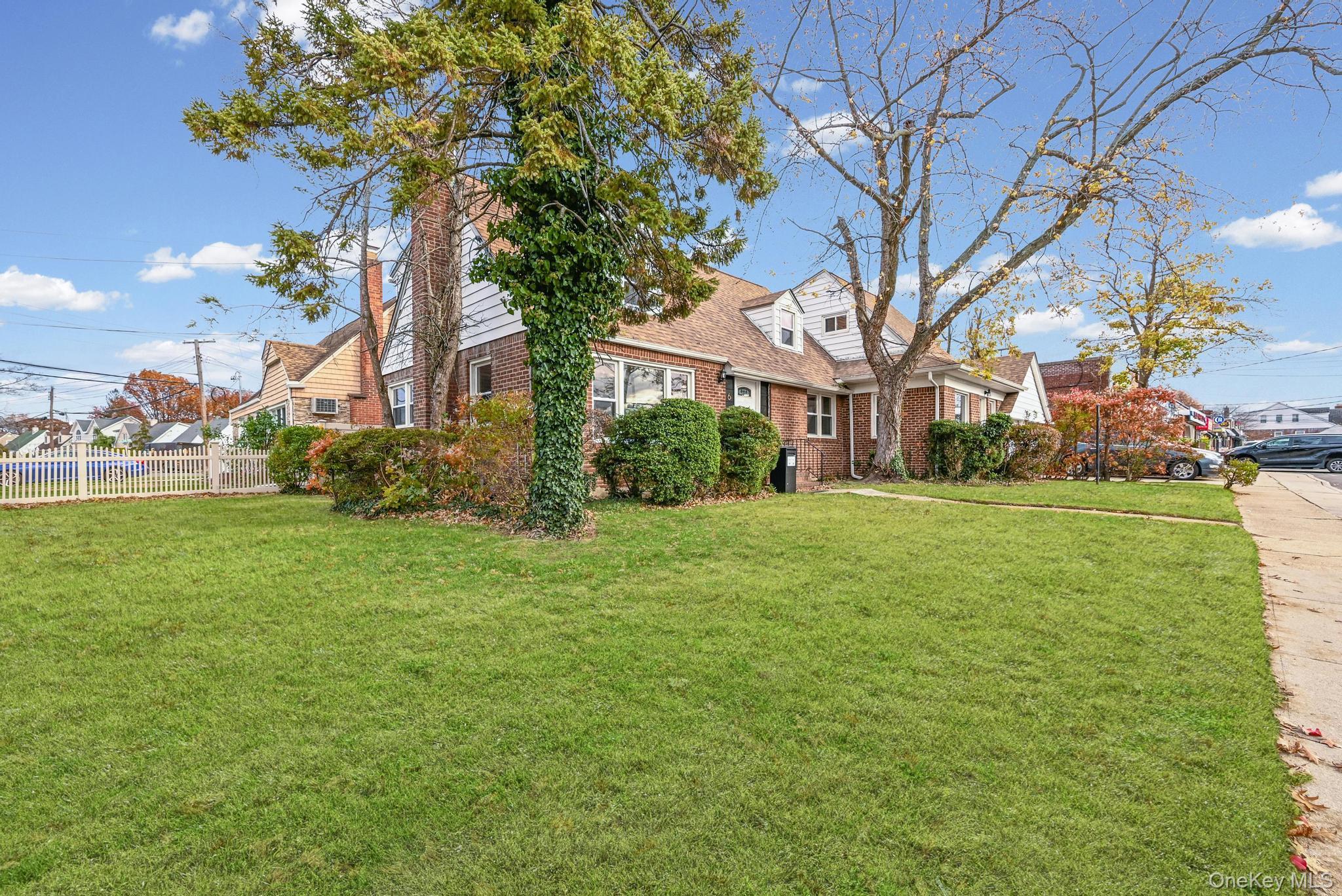312 Coventry Road South West Hempstead, NY 11552 - Photo 6 of 30 New england style home featuring brick siding and a residential view