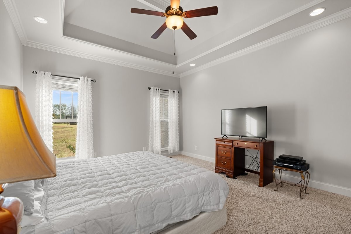 70 Cherokee Dock Road Lebanon, TN 37087 - Photo 20 of 48 a bedroom with a bed and a flat screen tv