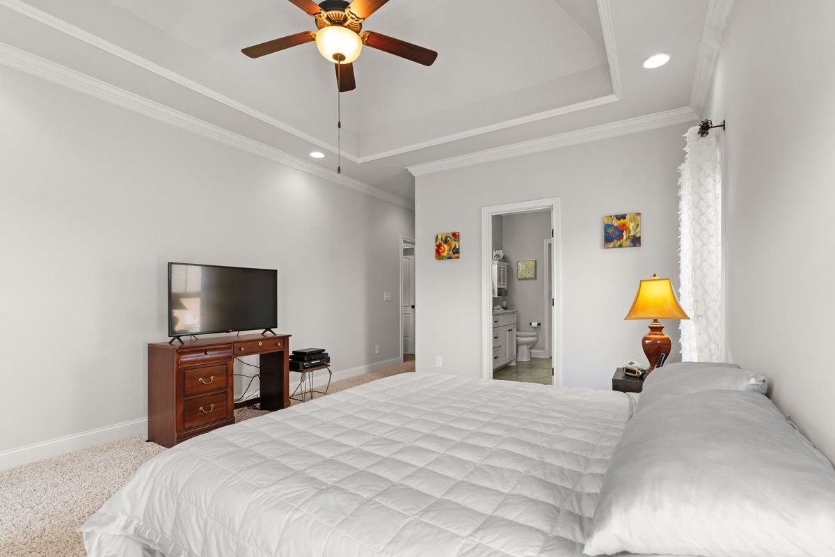 70 Cherokee Dock Road Lebanon, TN 37087 - Photo 22 of 48 a bedroom with a bed and a flat tv screen