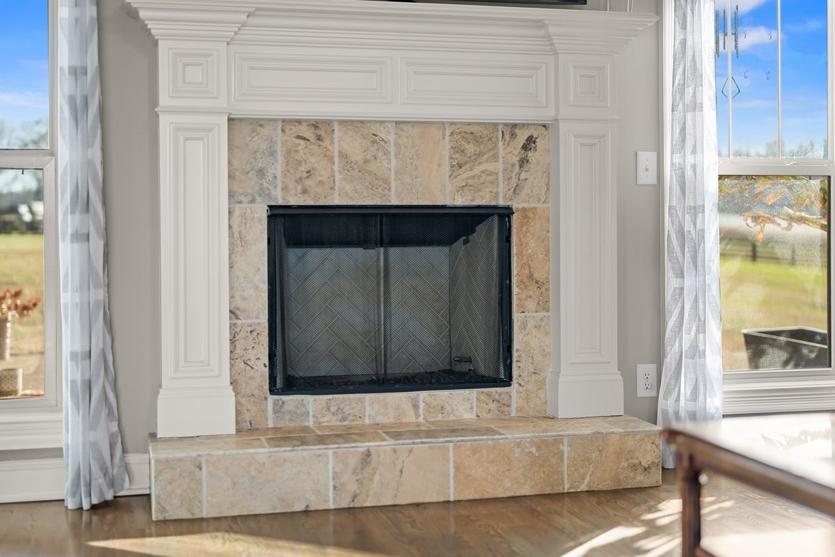 70 Cherokee Dock Road Lebanon, TN 37087 - Photo 10 of 48 a living room with a fireplace and a window