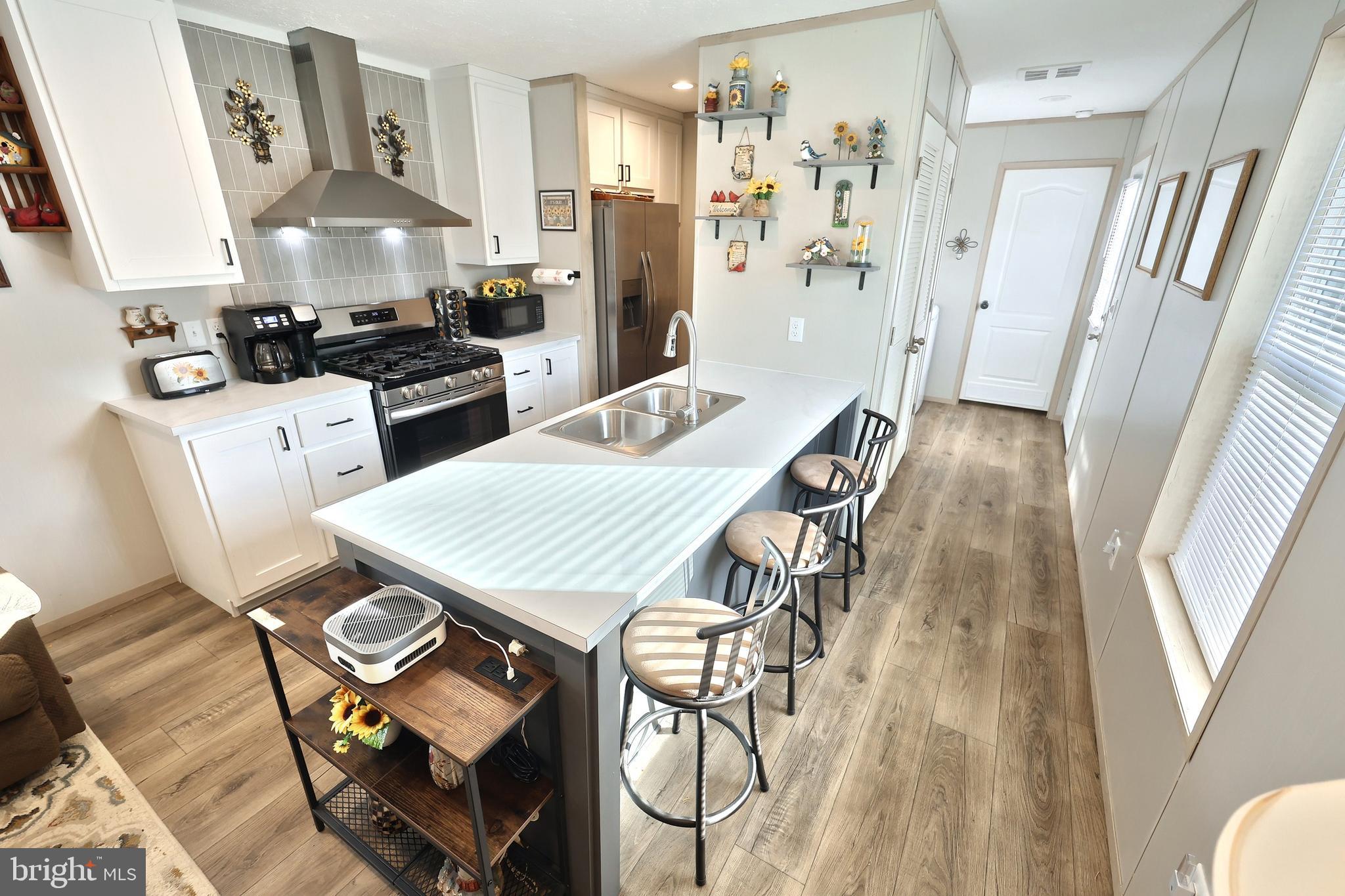 4 3rd Street York, PA 17406 - Photo 11 of 26 a kitchen with stainless steel appliances granite countertop a refrigerator and a stove top oven