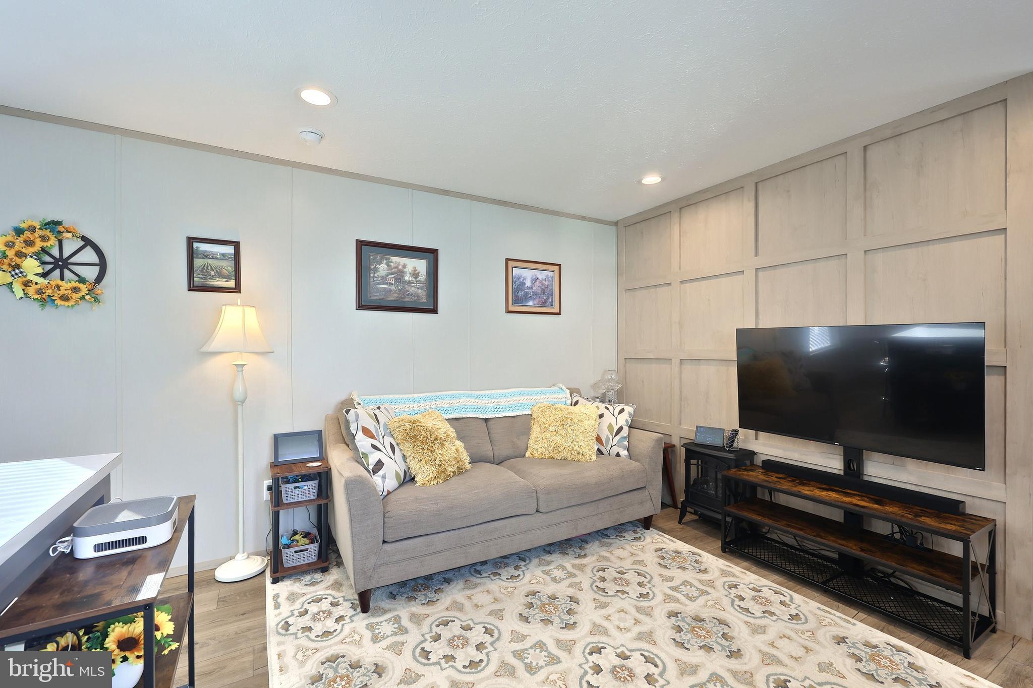 4 3rd Street York, PA 17406 - Photo 6 of 26 a living room with furniture and a flat screen tv
