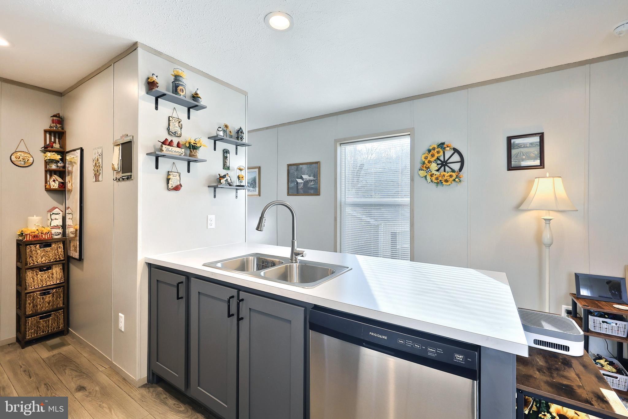 4 3rd Street York, PA 17406 - Photo 8 of 26 a kitchen with a sink cabinets and a refrigerator