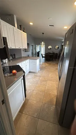a kitchen with a sink a stove and cabinets