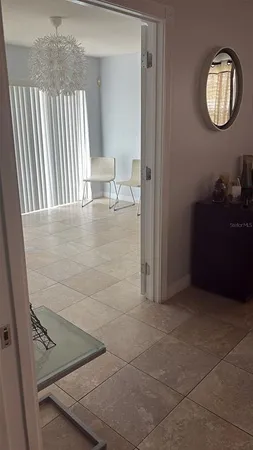 a view of a hallway with seating area