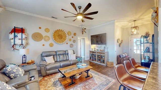 a living room with fireplace furniture and a flat screen tv